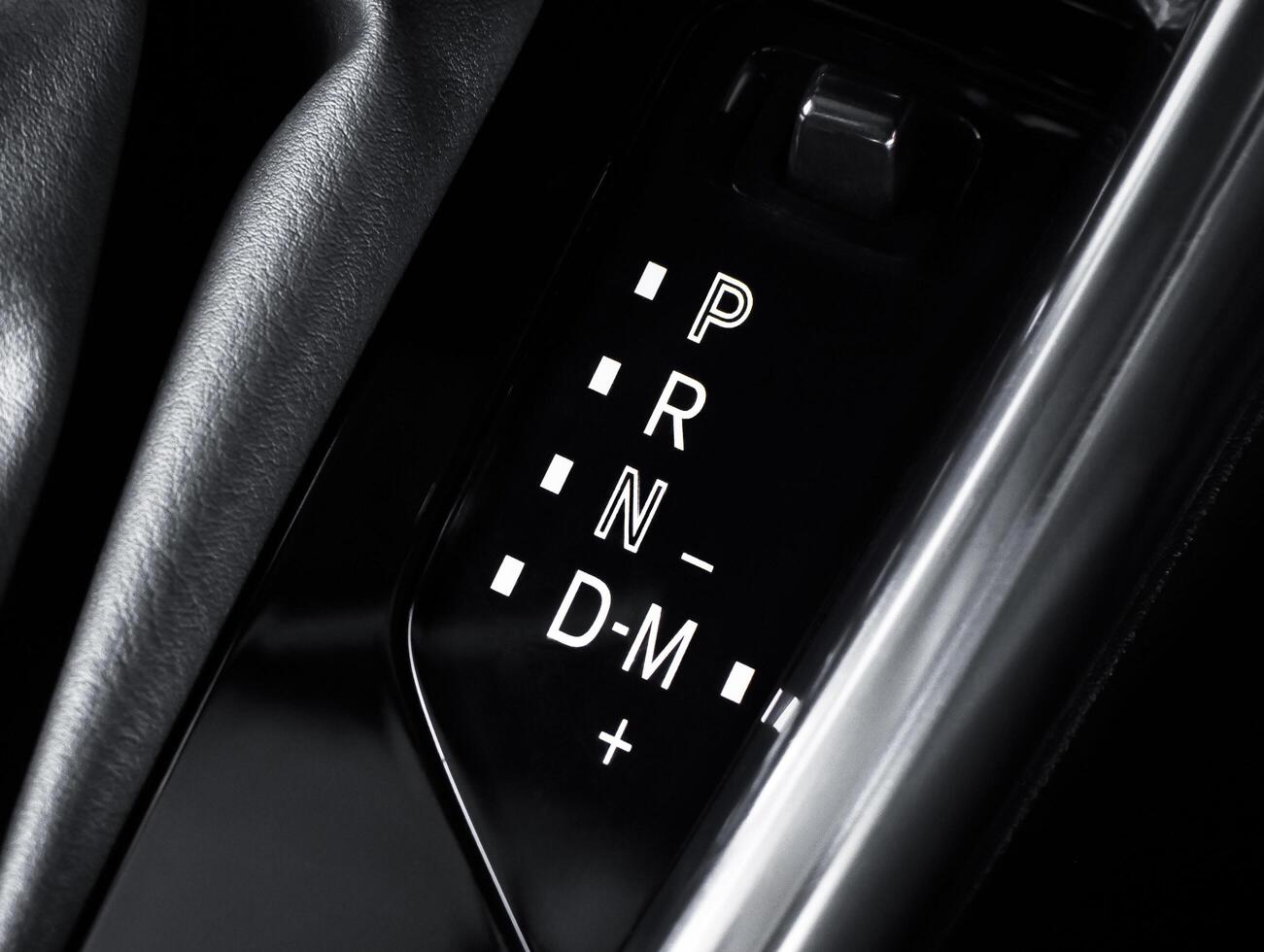 Closeup of car gear selector, automatic transmission display. Shifter, P R N D M modes. photo