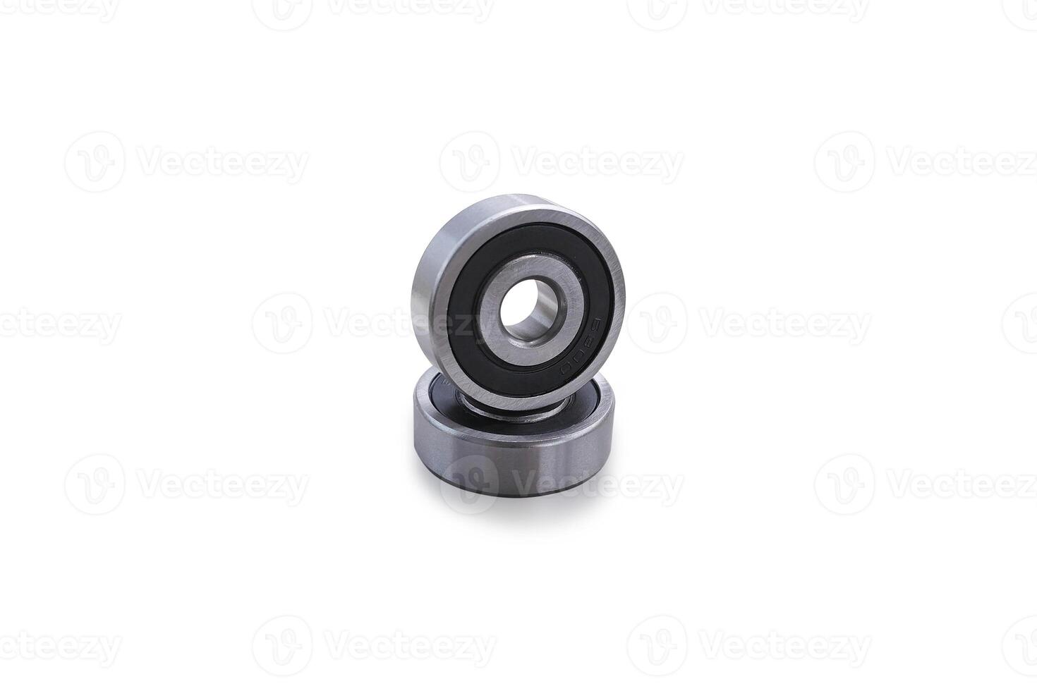 Two shiny metal bearings isolated on a white background include clipping path. photo