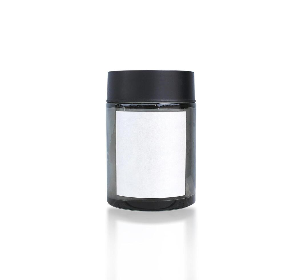 Clear Black Glass Container, A transparent cylindrical glass container with a blank white label and a black lid, isolated on white include clipping path. photo