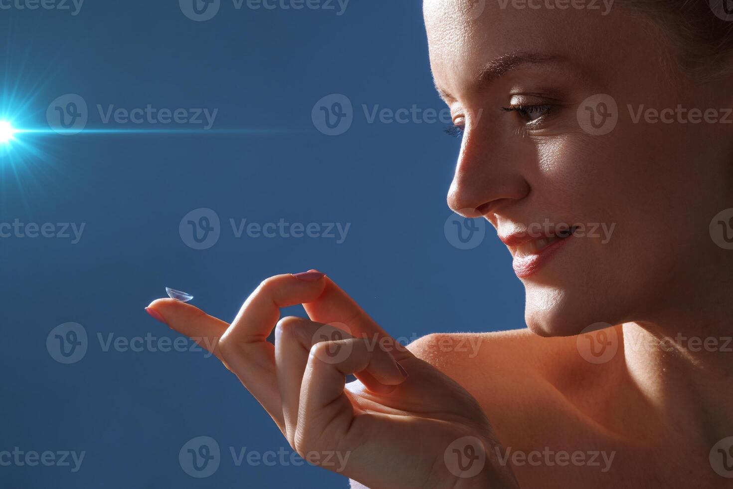 Woman Holding Contact Lens on Finger Smiling for Vision Improvement and Glasses Replacement Solution photo