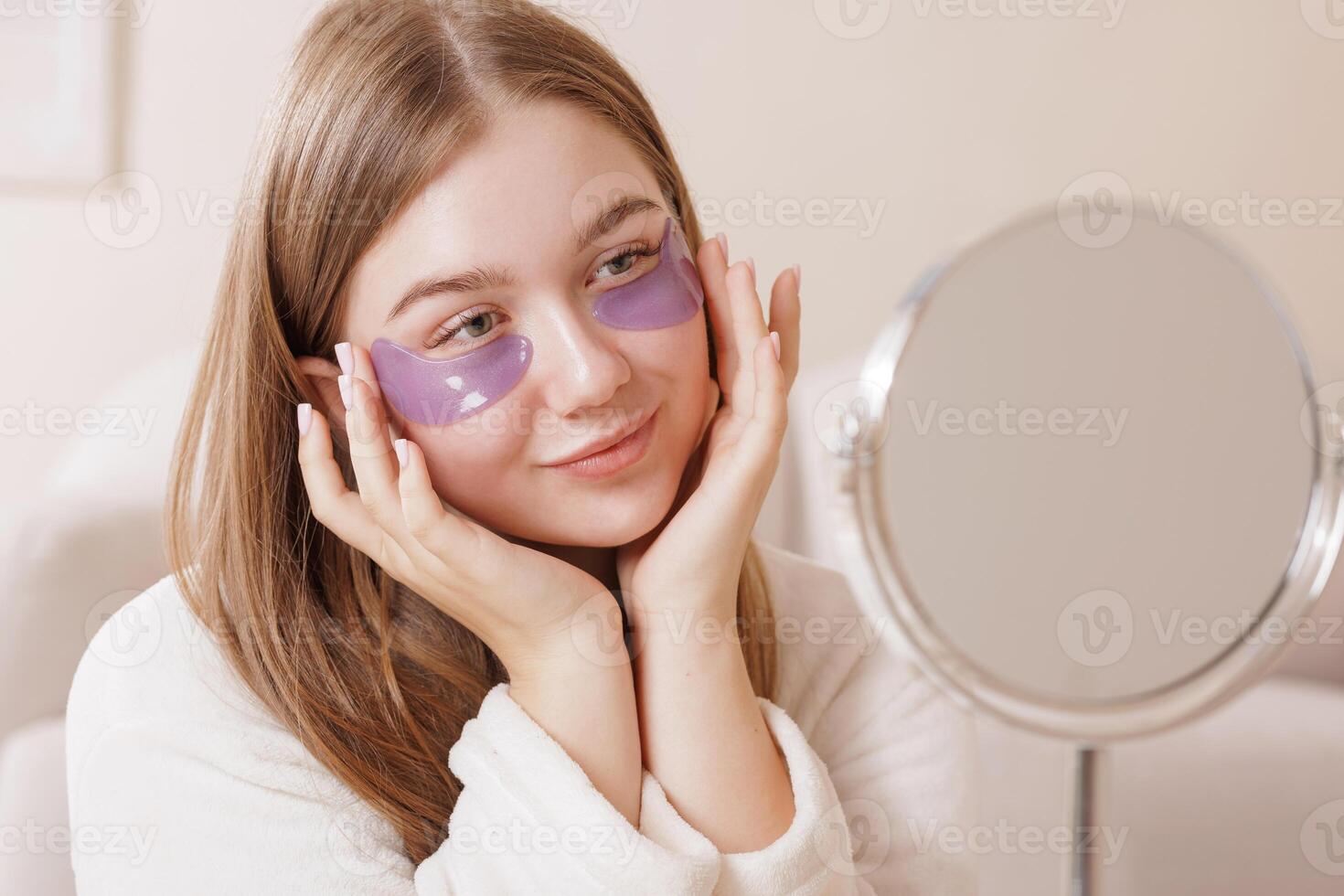 Young Woman Using Hydrogel Under Eye Patches for Rejuvenation Wrinkles and Skincare Beauty Routine photo