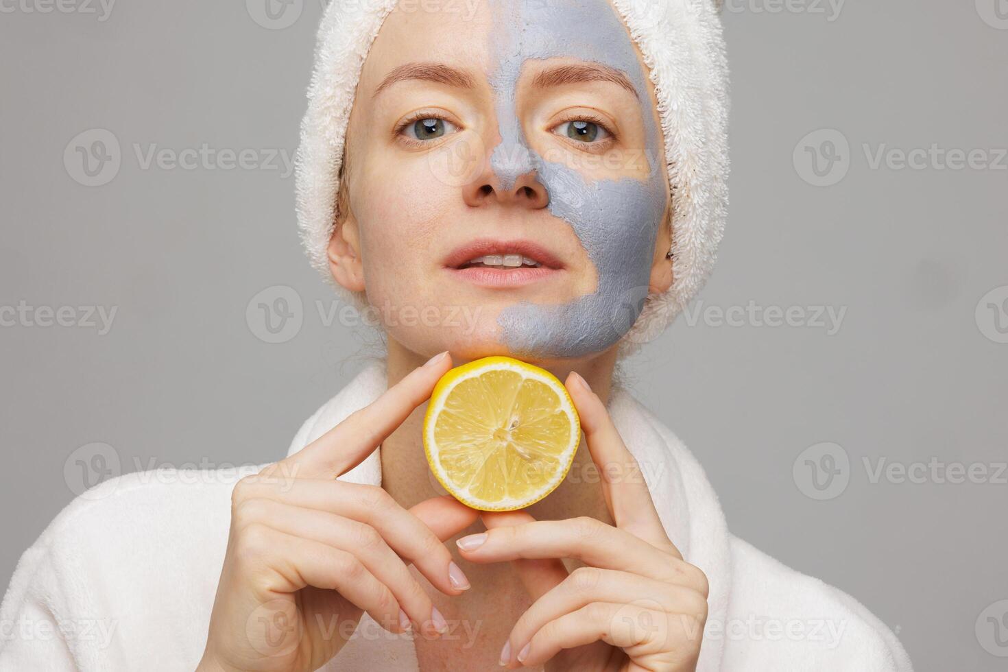 Confident Woman with Clay Facial Mask and Lemon, Spa Anti Aging Skin Care with Firming and Cleansing Effect photo