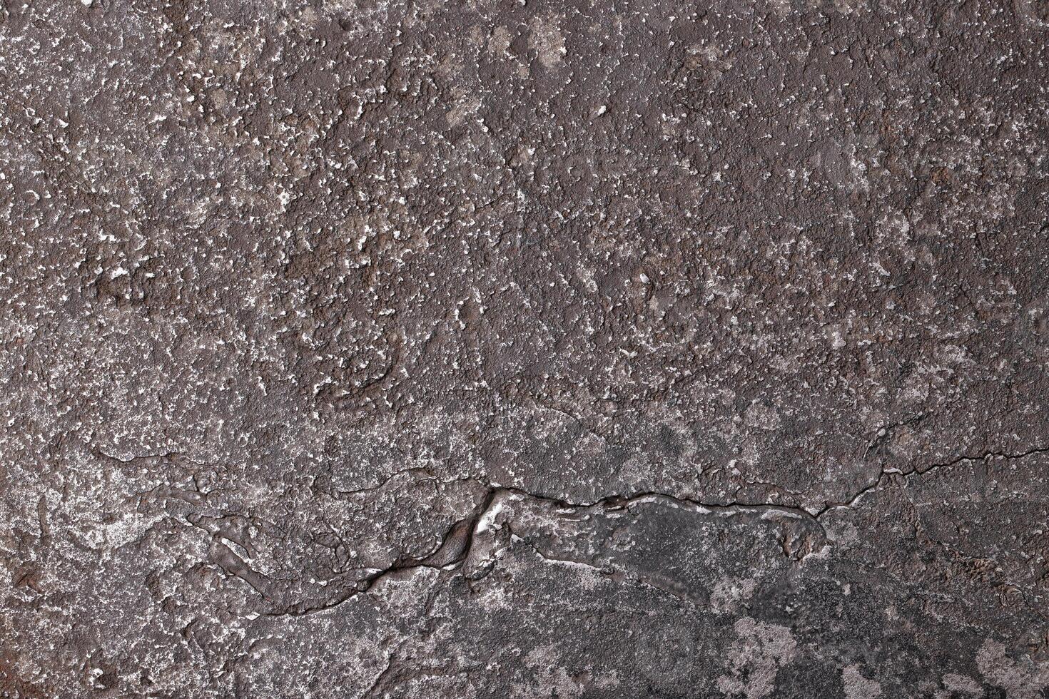 eroded texture steel or another alloy metal background with cracks and scratches photo