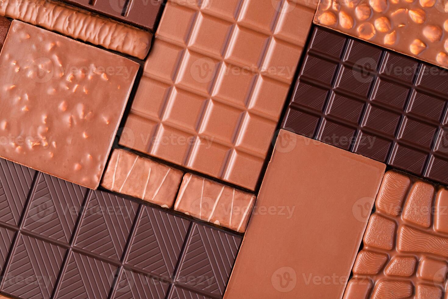 Various chocolate bar, top view. Delicious cocoa dessert, food background. photo