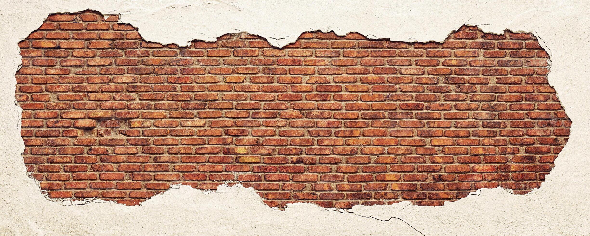 rustic brick wall with peeling concrete, texture of old stonework as background photo