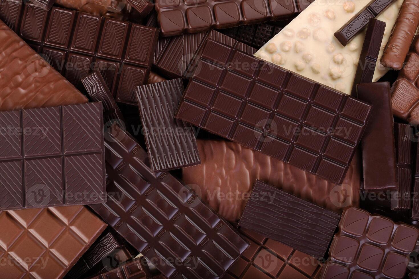 large chocolate bar, sweet candies. dessert food background. photo