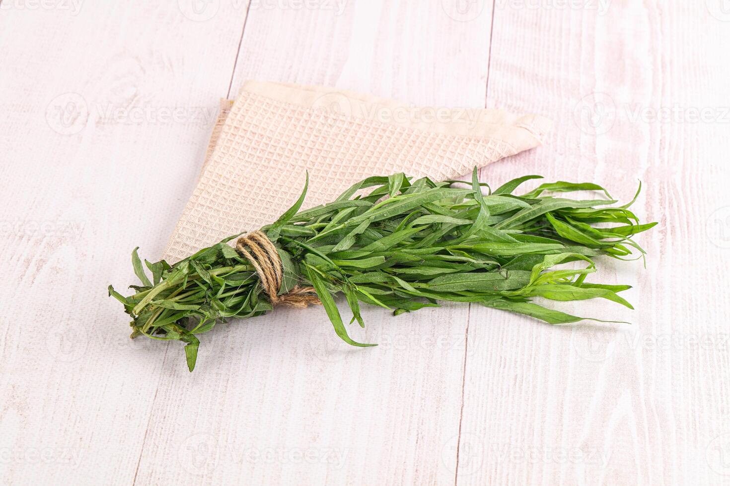 A bunch of herbs tied to a towel photo