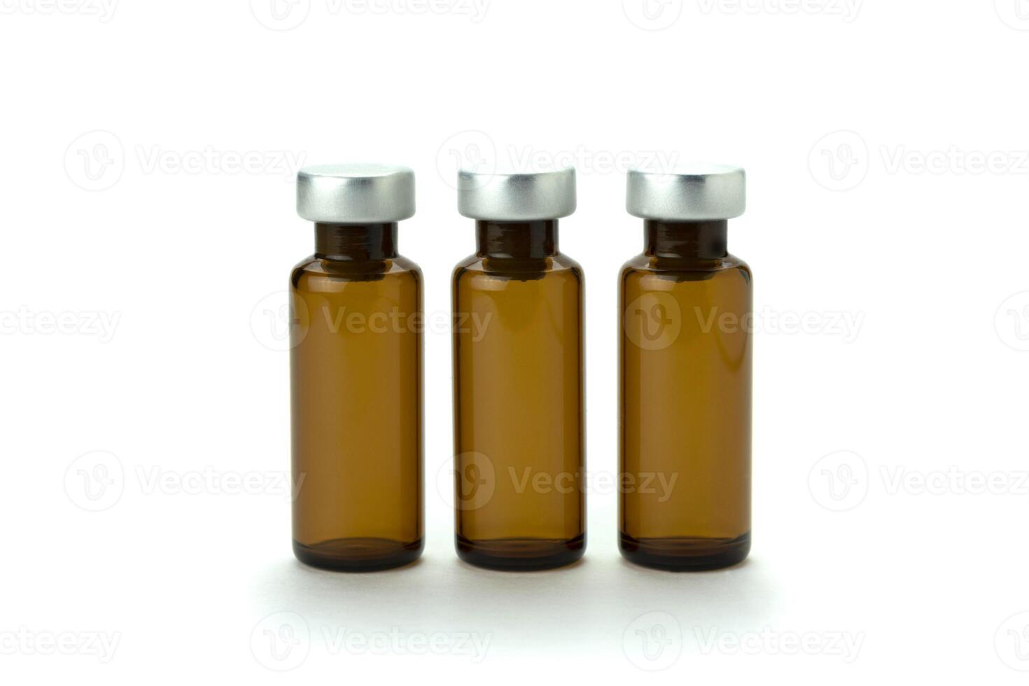 Medical bottle of brown color, for medicine and injection, with a lid, isolated on a white background. Close-up. photo