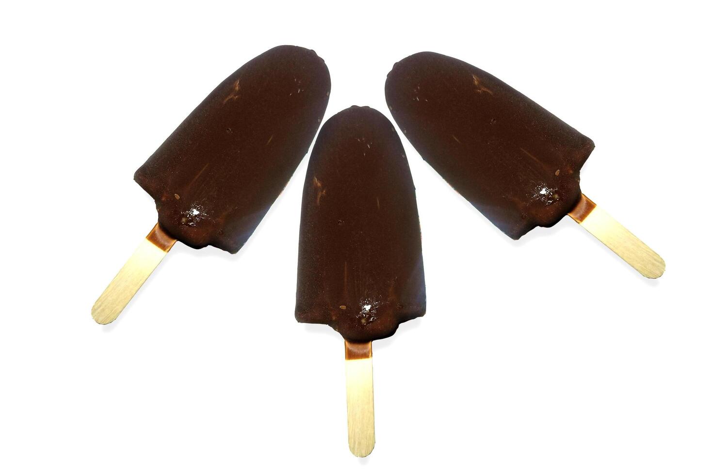 Three chocolate icecreams isolated on white background photo