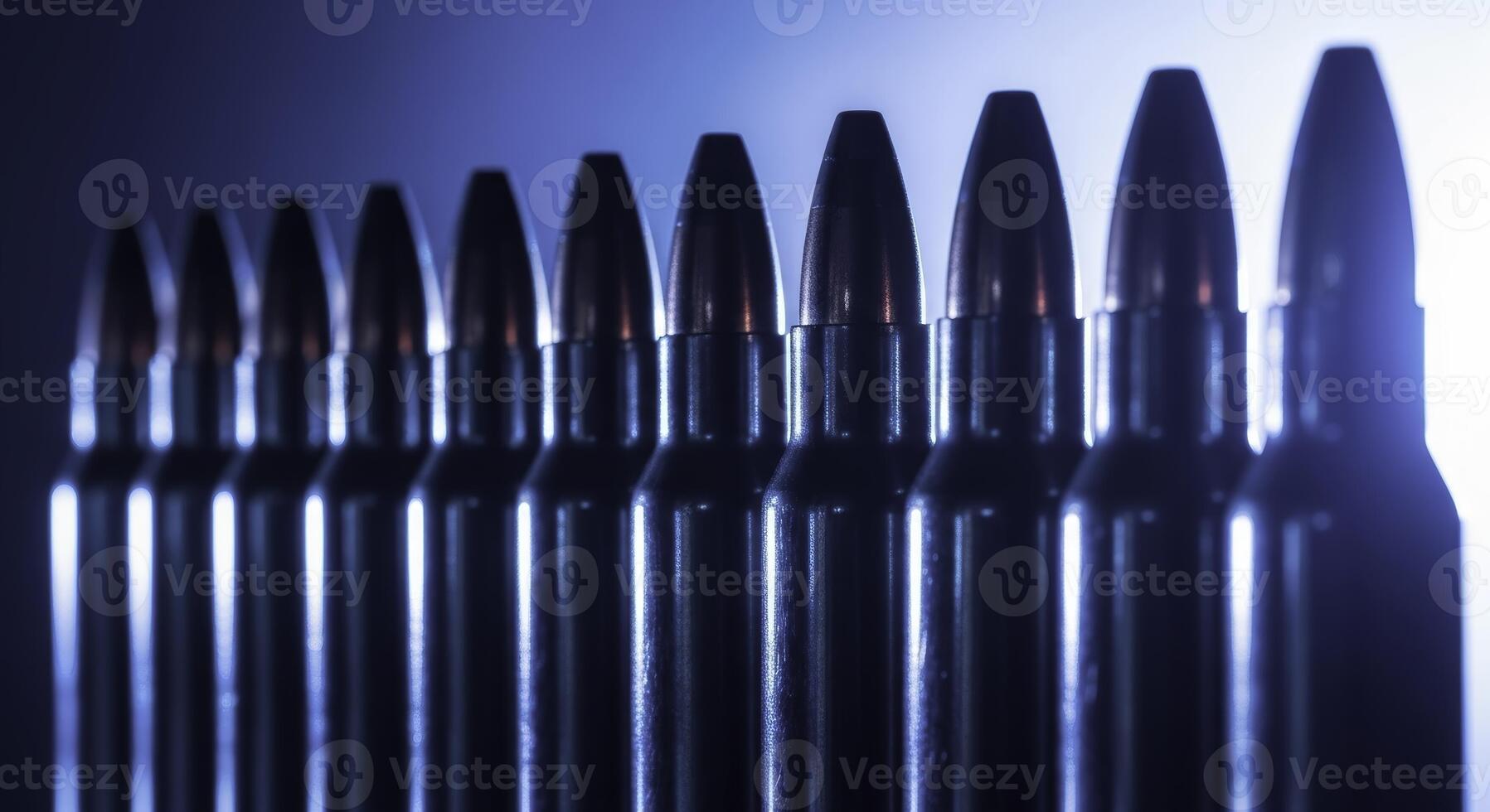 Perfectly aligned row of polished chrome rifle cartridges and bullets photo