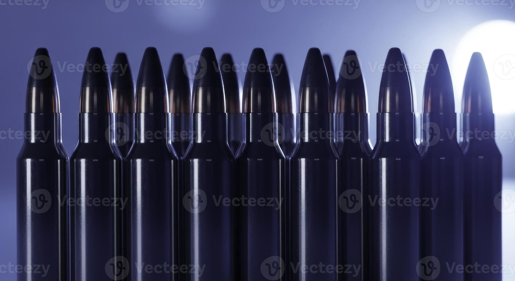 Perfectly aligned row of polished chrome rifle cartridges with dark lead bullet tips photo