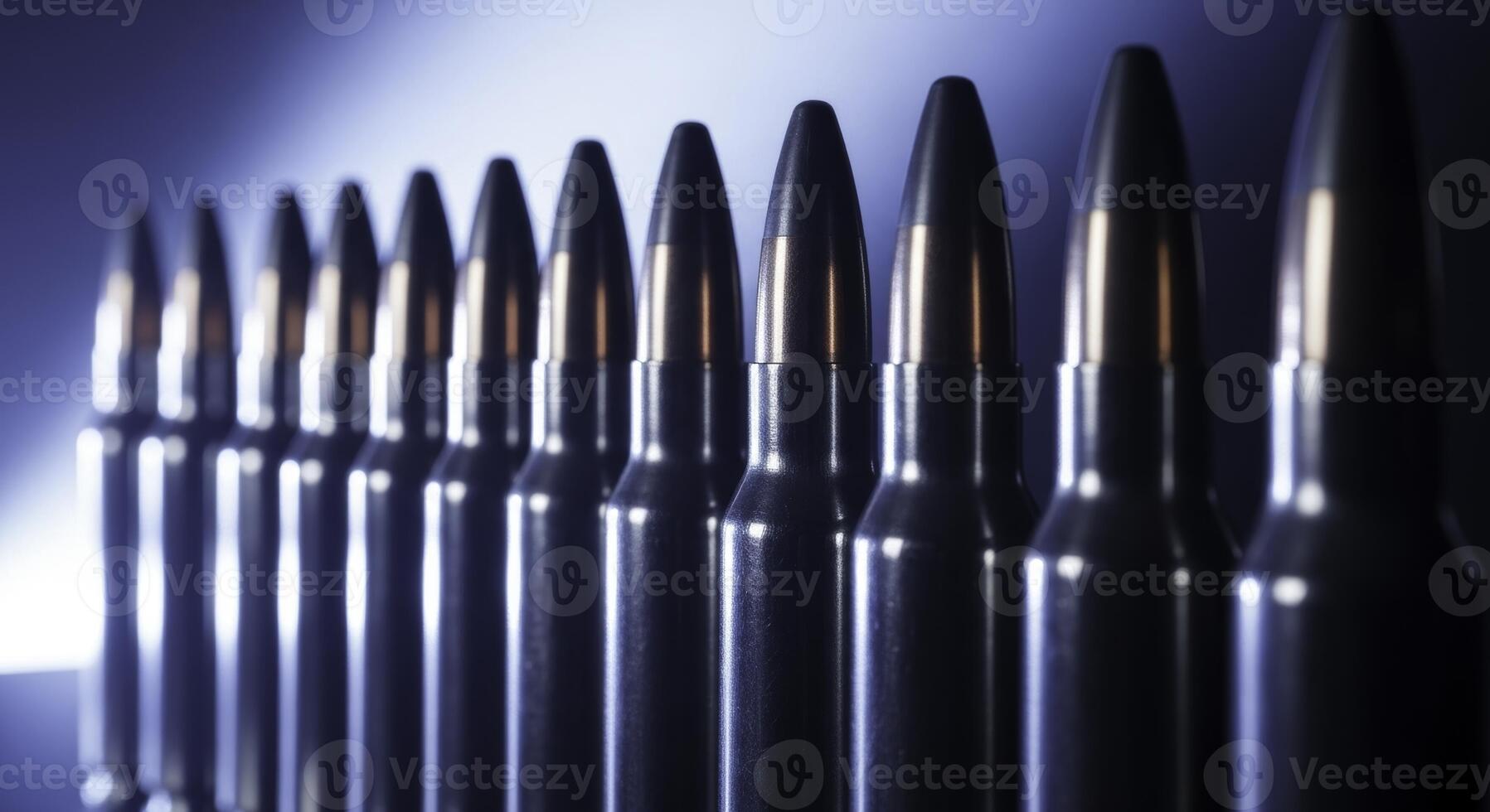 Perfectly aligned row of polished rifle cartridges with dark bullet tips photo