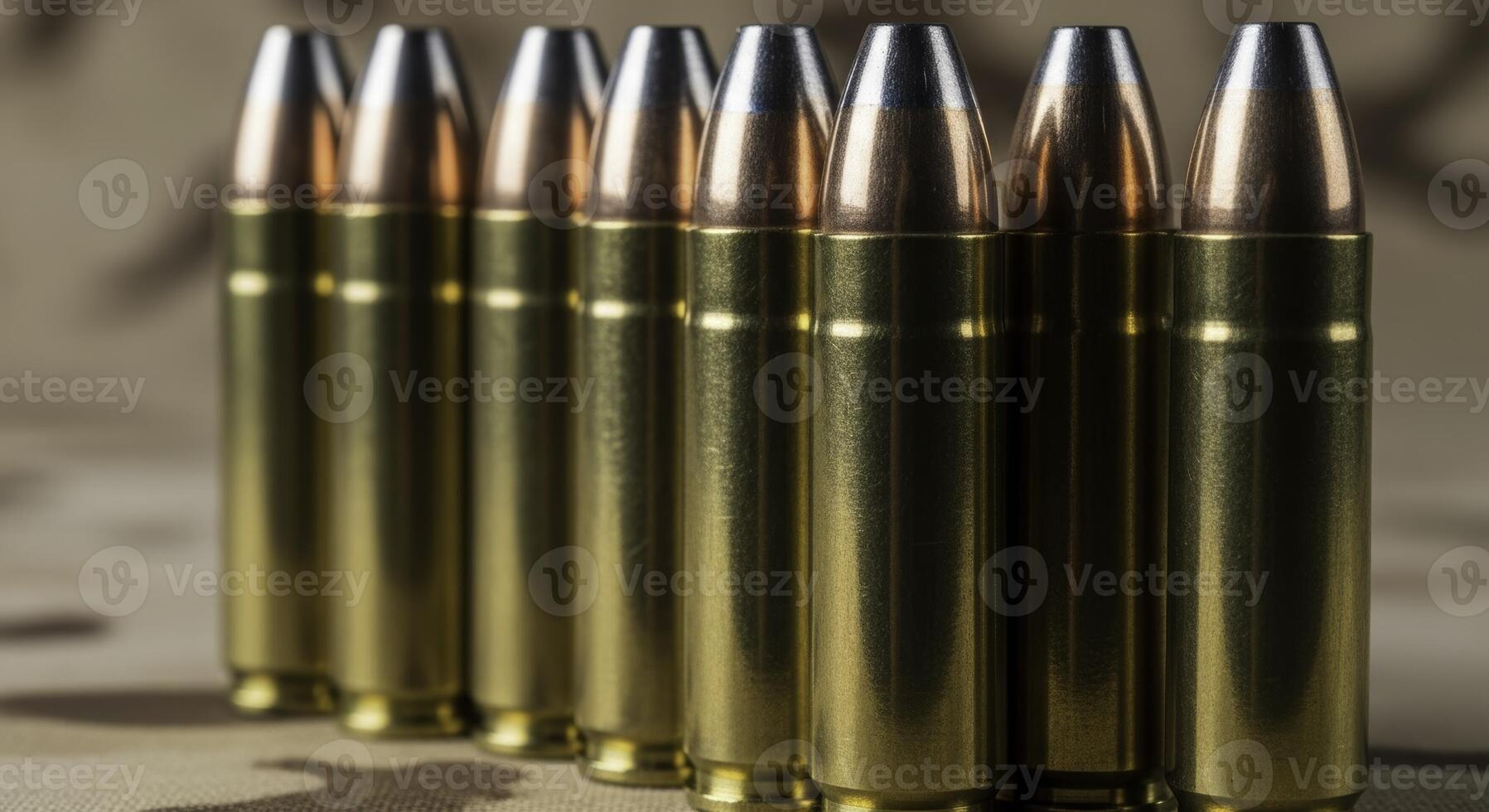 Close up of seven .45 caliber ammunition rounds with brass casings and silver projectiles standing upright photo