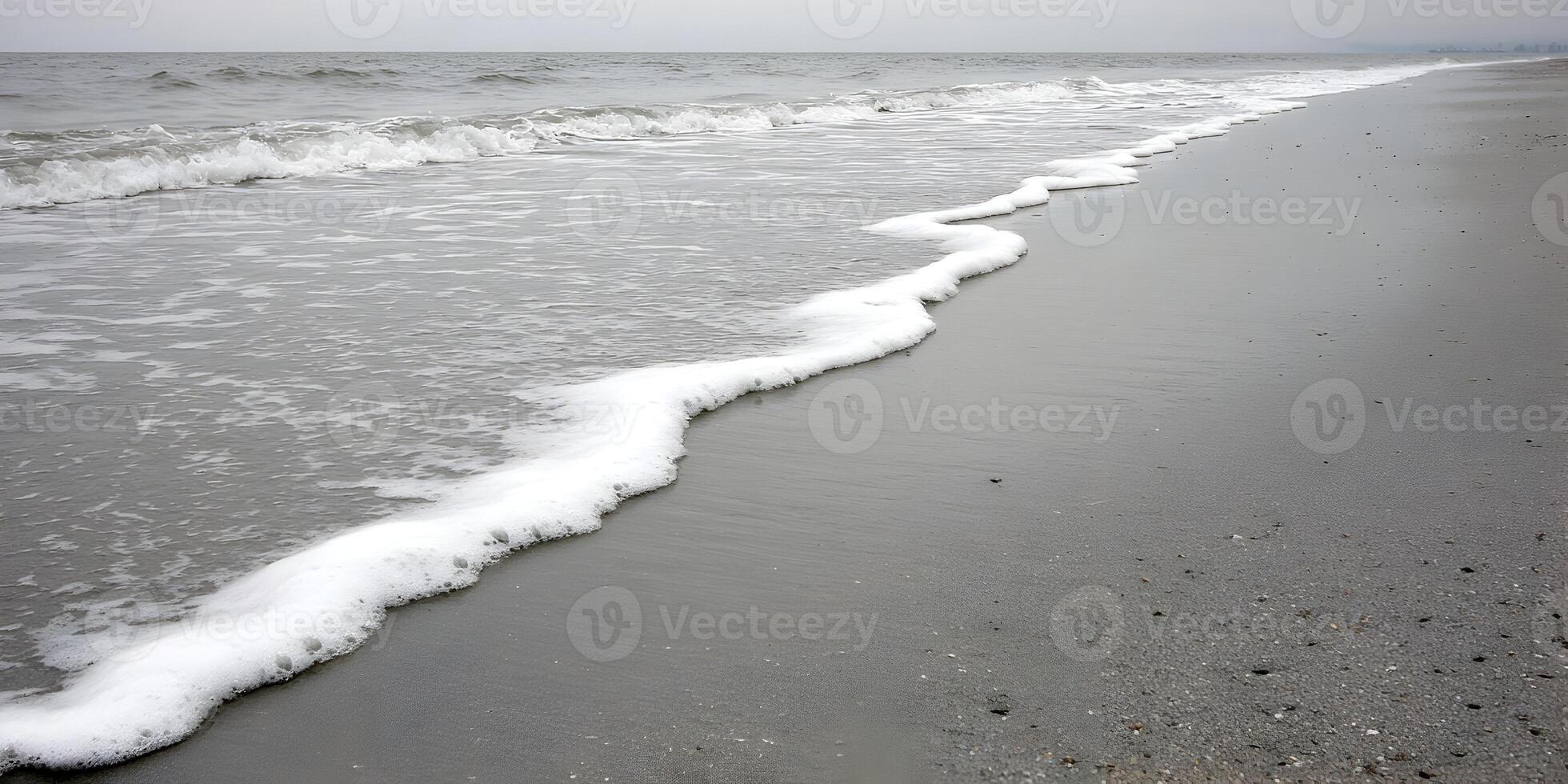 Ocean Waves on Sandy Beach Grey Tones Calm Sea Foam photo