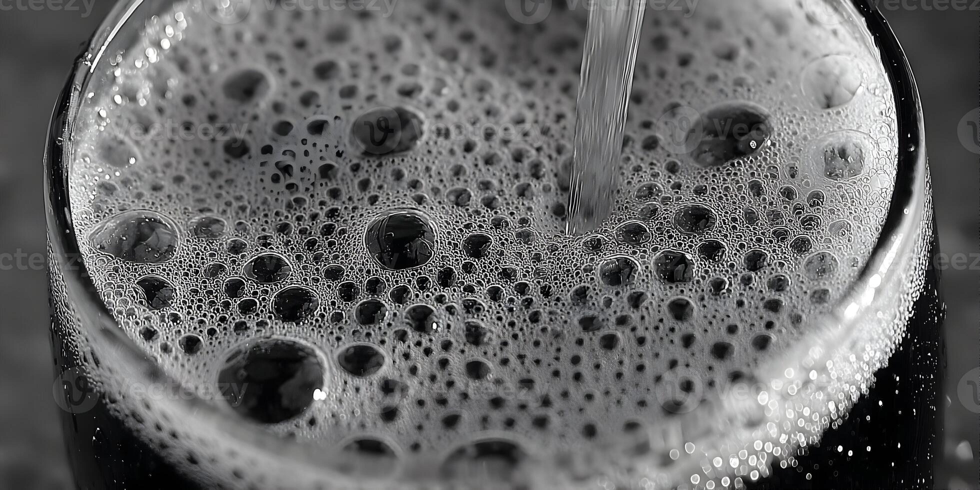 Closeup Black and White Photo of Bubbles in a Glass of Beer