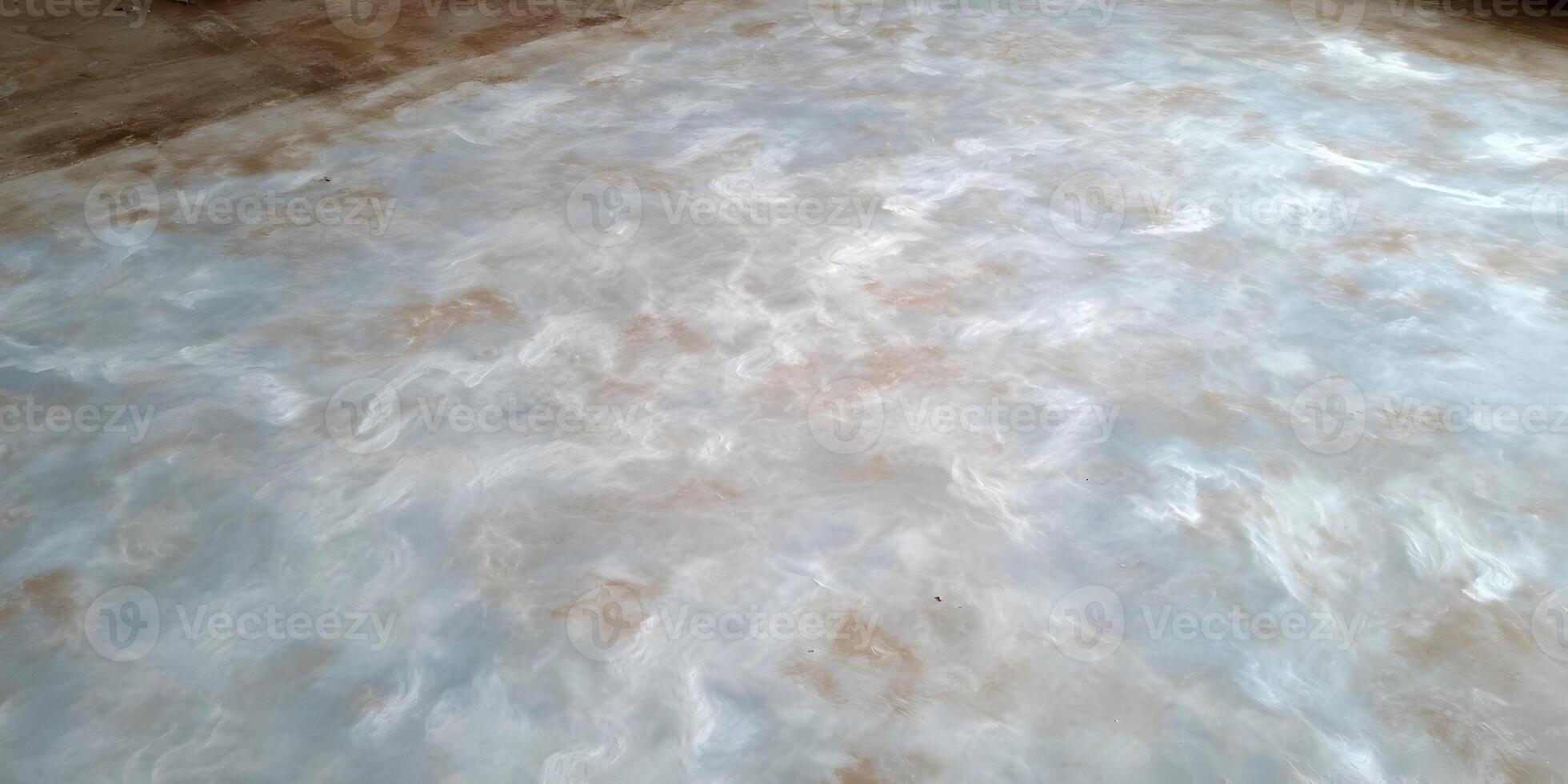 Light Blue and Beige Swirl Concrete Floor Texture Background photo