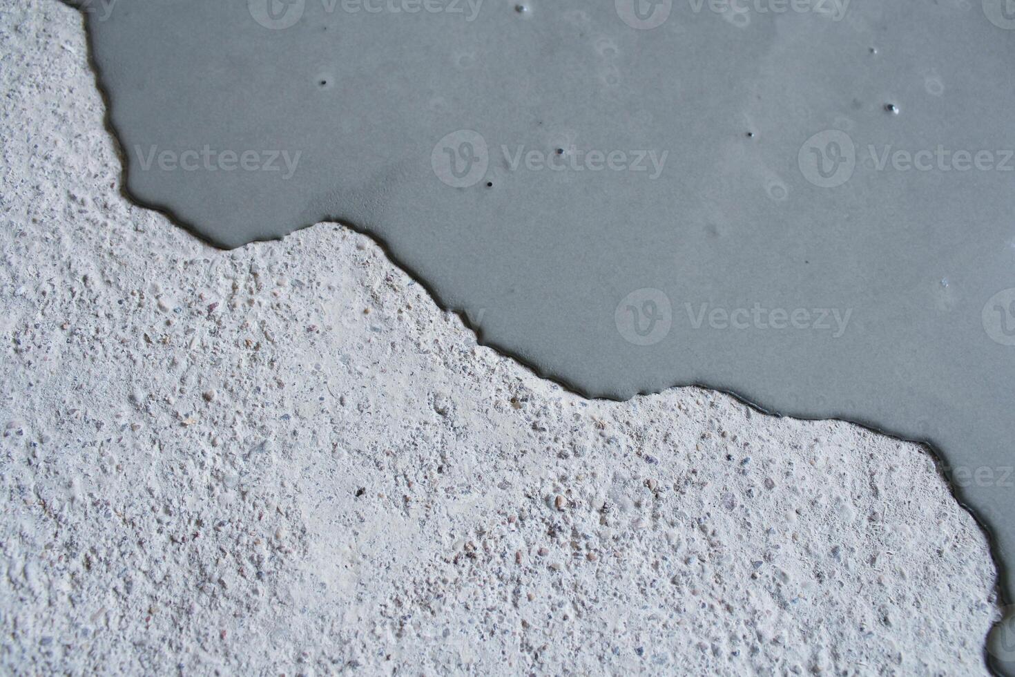 Concrete background. Self leveling compound spreading. photo