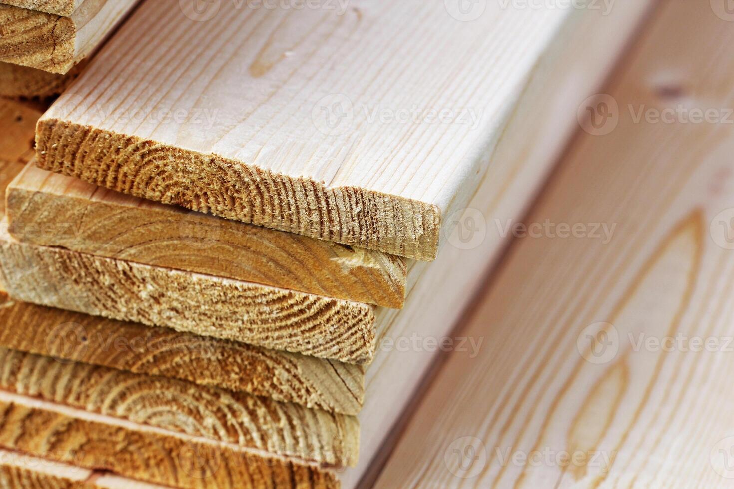 Pile of new wooden boards on a storage. Side background texture photo