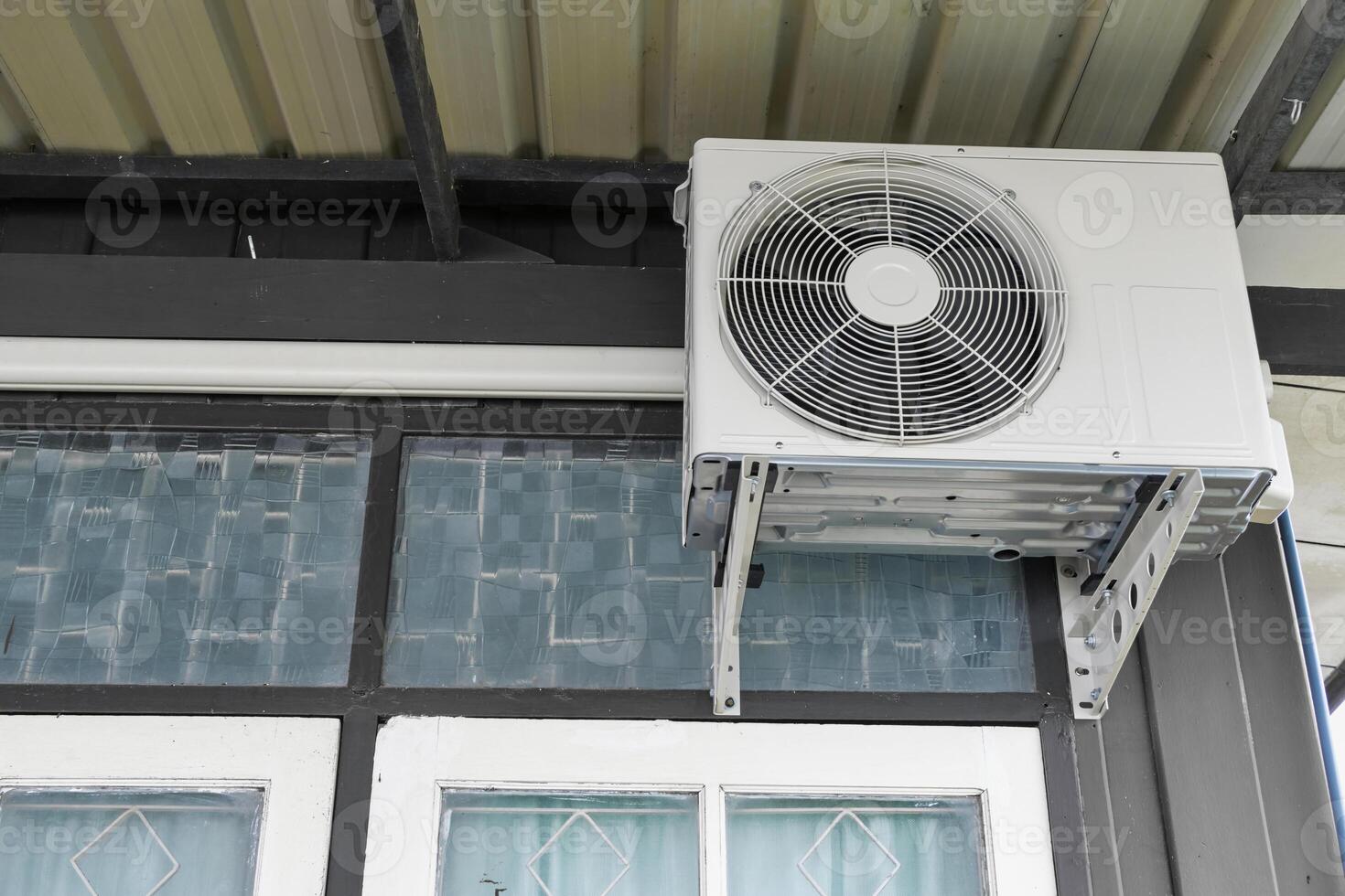 Air Compressors Installed on the side house photo