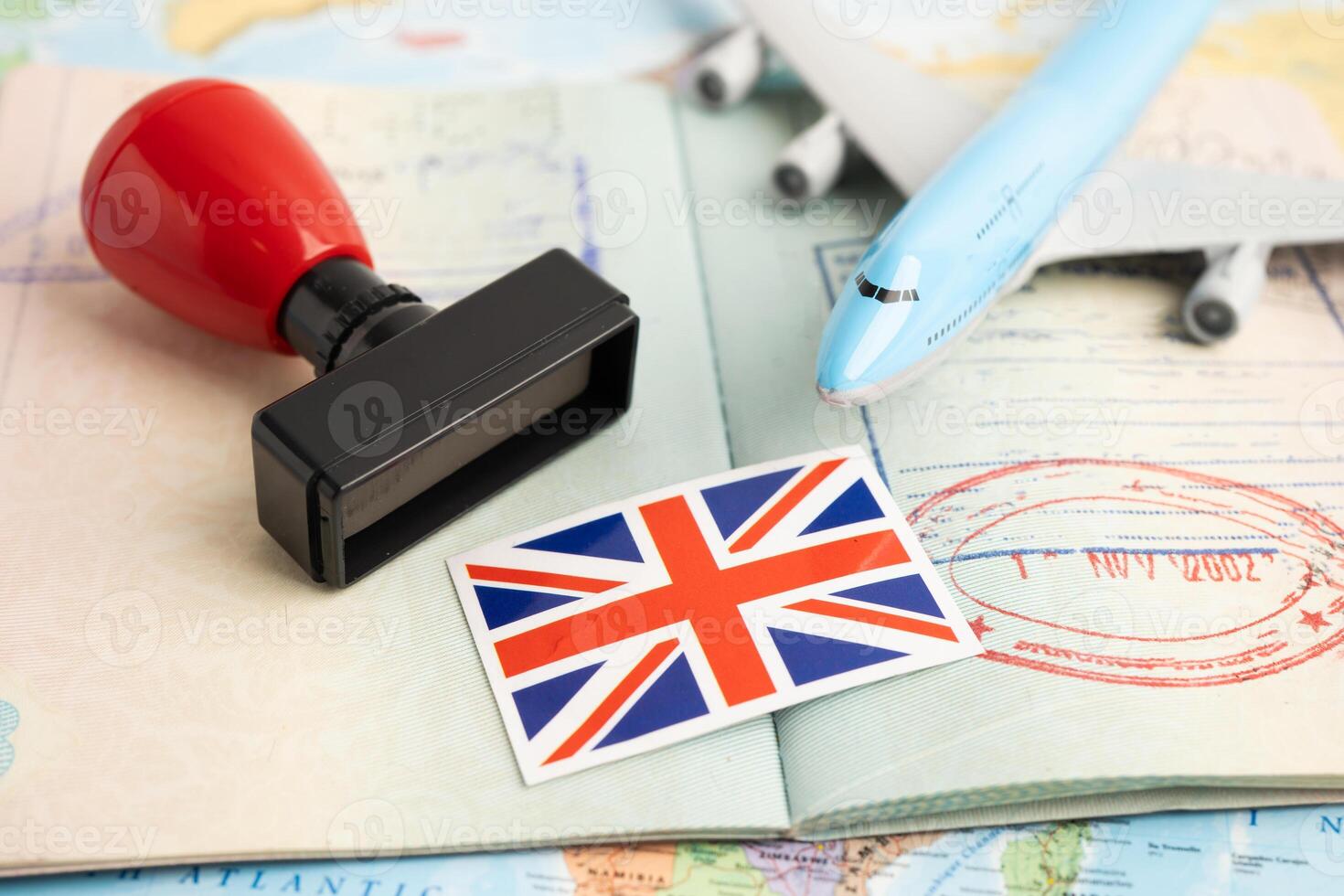 UK United Kingdom flag with passport and airplane photo