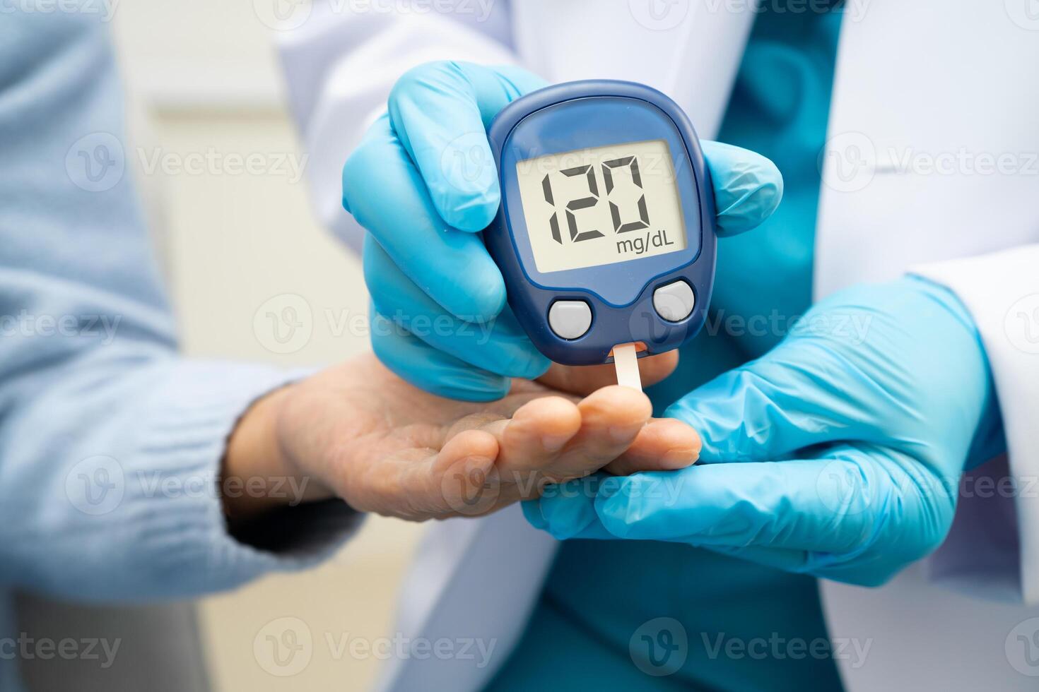 doctor using digital glucose meter for check sample blood diabetes. photo