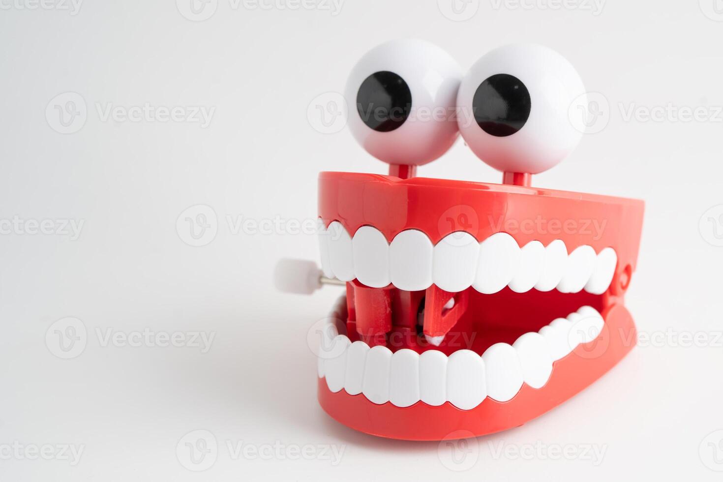 Funny red teeth with eye toy denture model for dental photo