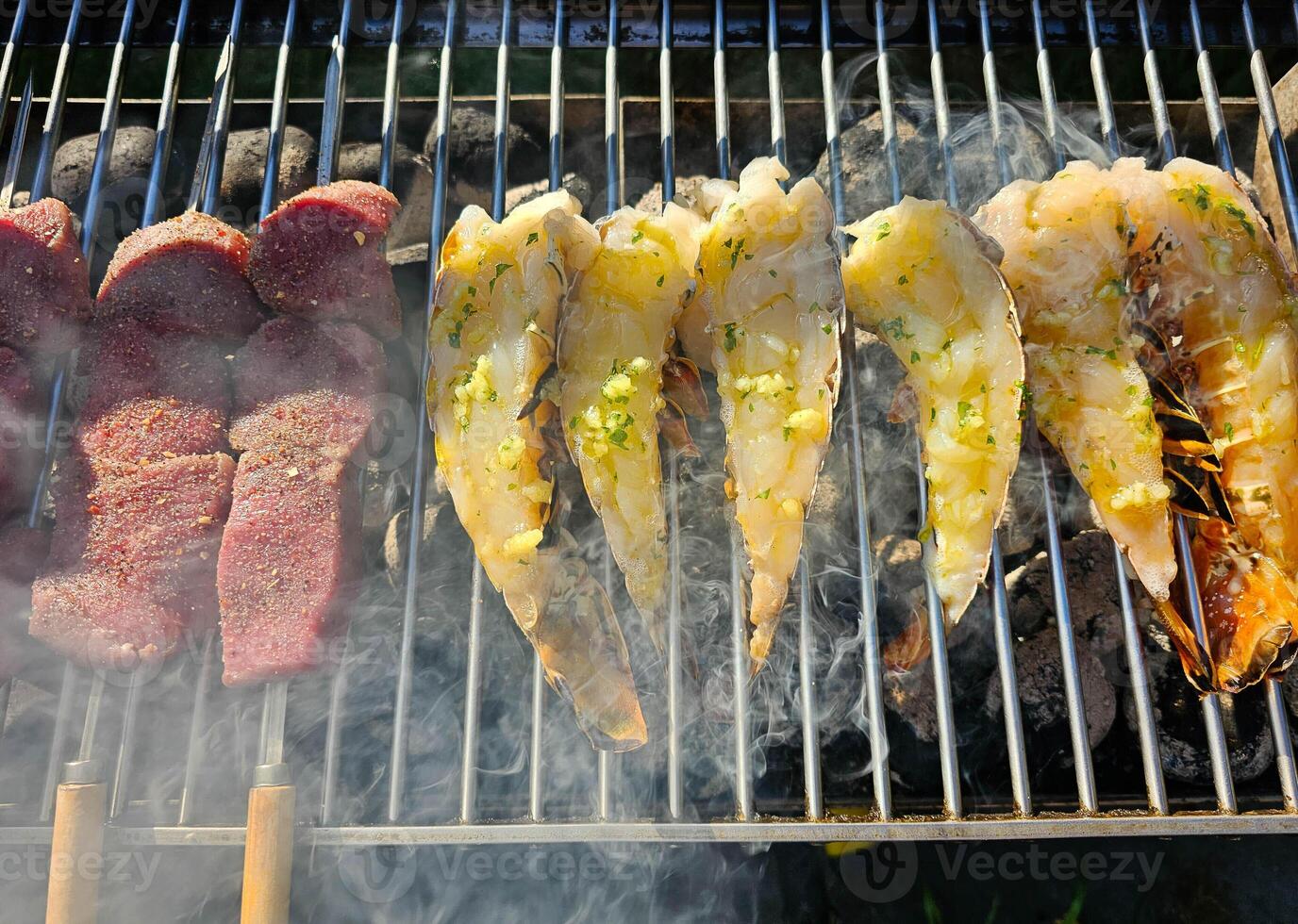Surf and turf fillet steak and Lobster on a grill photo