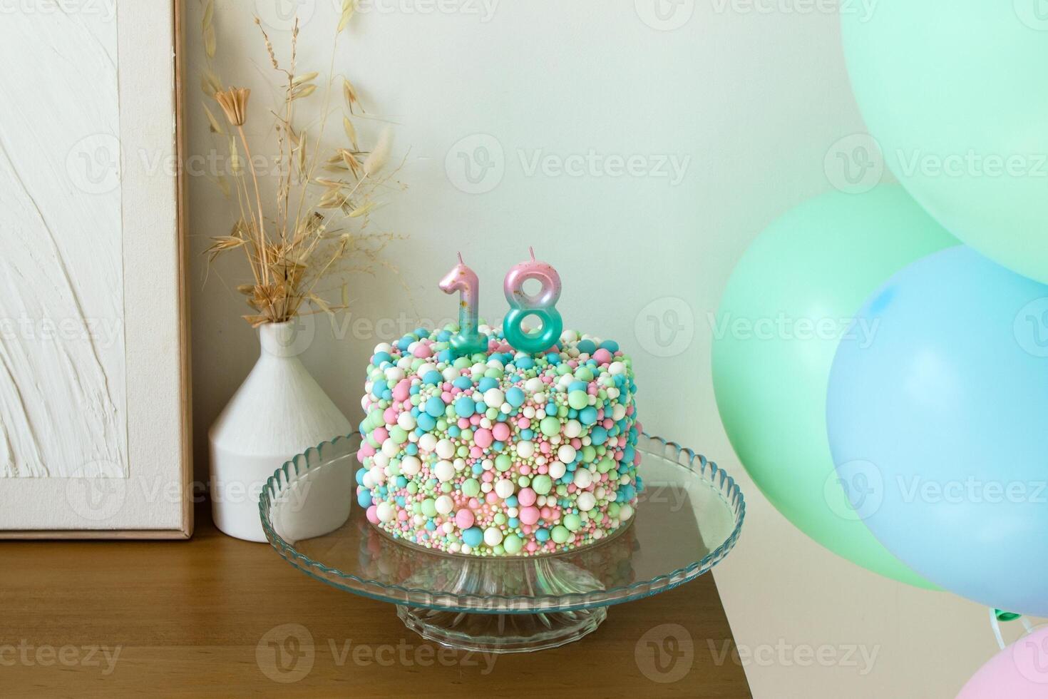 Celebratory 18th Birthday Cake with Colorful Balloons, Festive Decoration in a pastel colors. photo