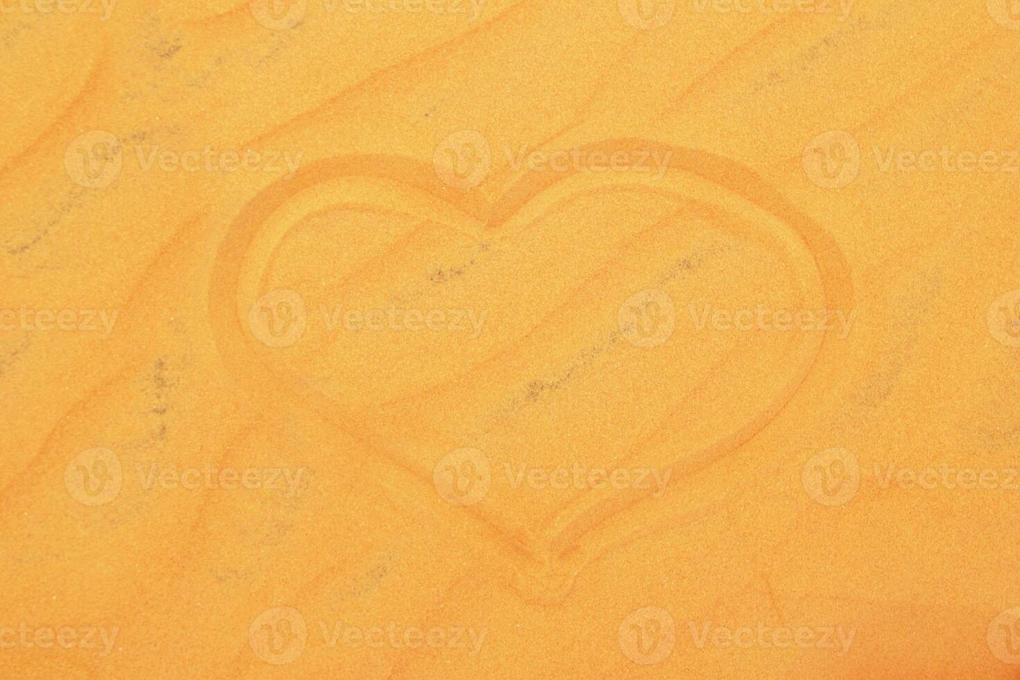 Heart Shape in Sand. A Symbol of Love and Affection on a Sandy Beach Surface. photo