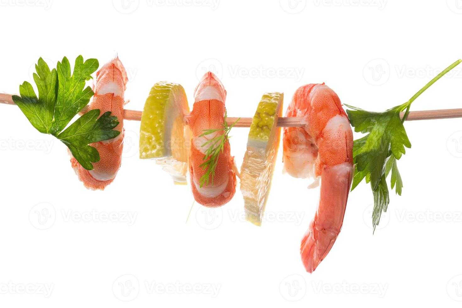 Boiled seafood shrimps with lemon isolated photo