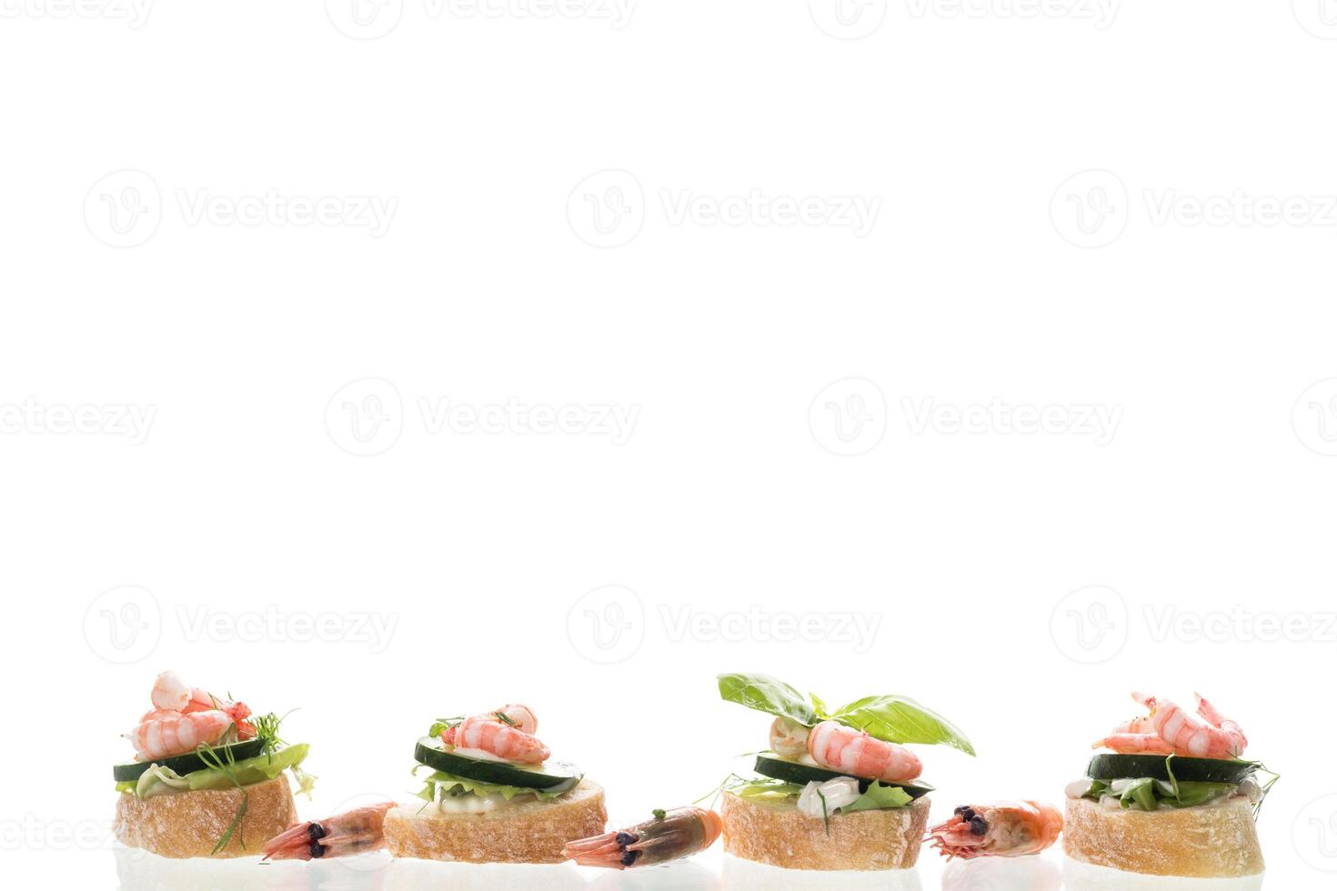 Gourmet appetizer with shrimps, greens and cucumbers for a buffet photo