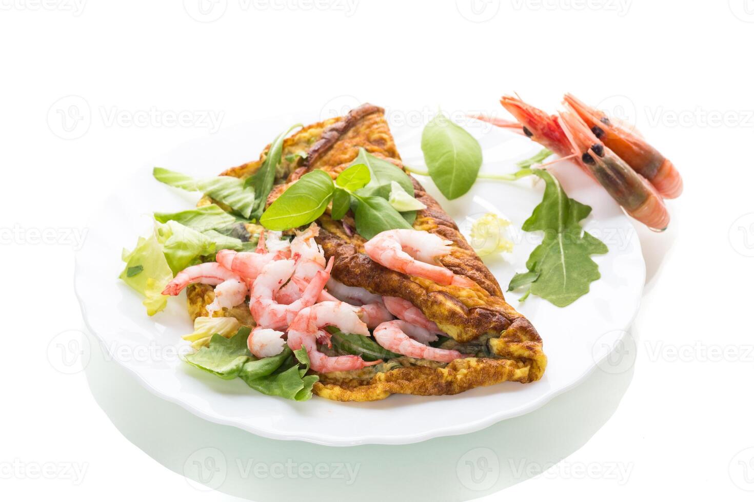Appetizing breakfast omelet with shrimps and dill, on a white background photo