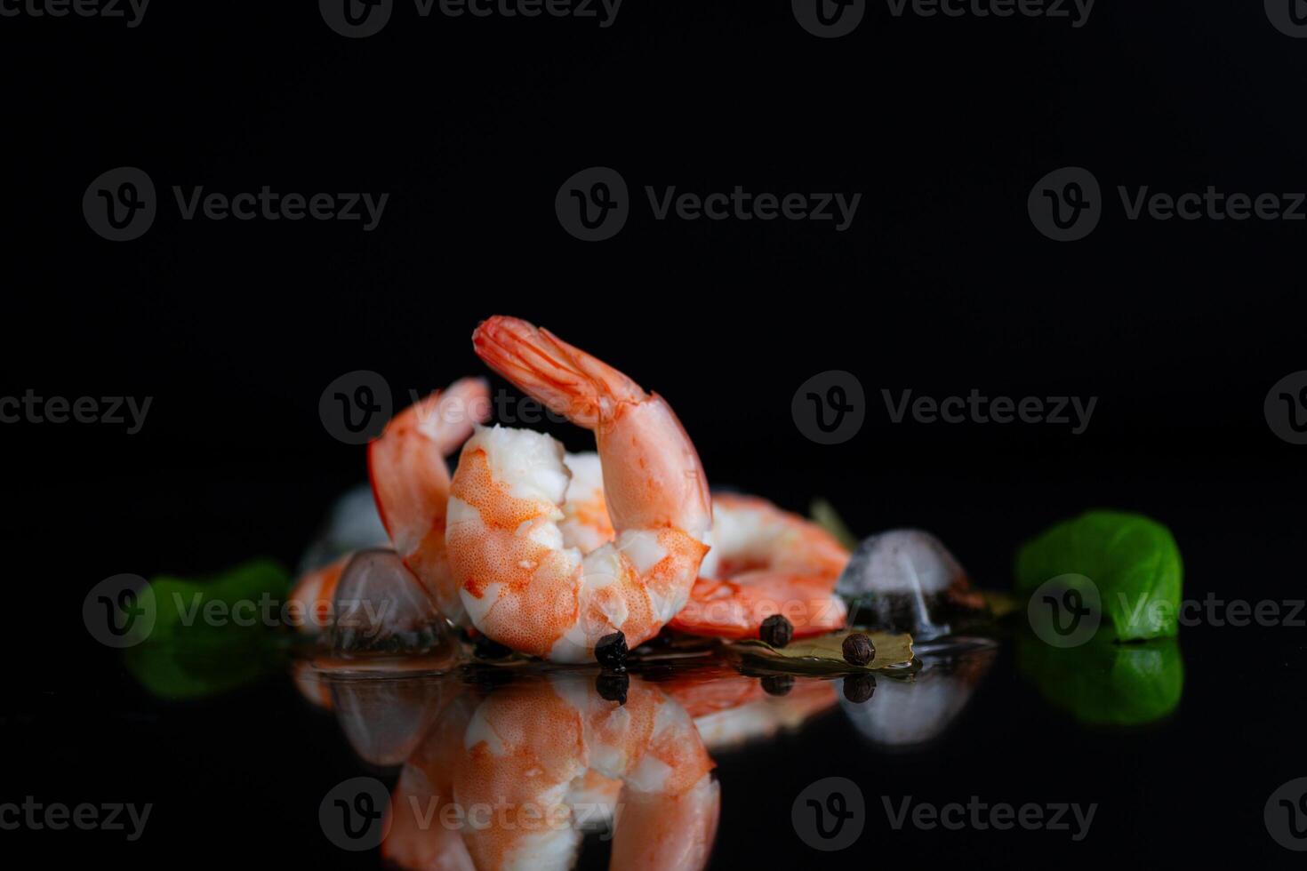 Isolated studio composition of shrimp and spices on a background photo