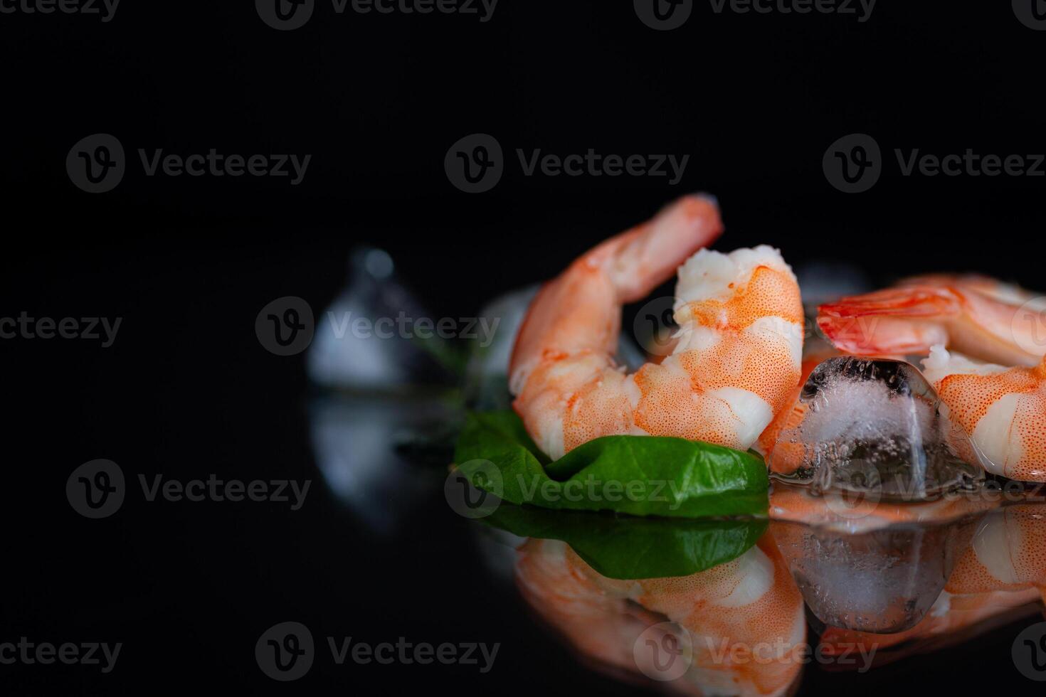 Still life with chilled shrimp, spices and ice cubes . photo