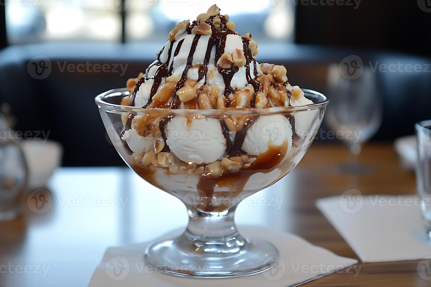 Coconut Ice Cream Topped with Peanuts and Chocolate photo
