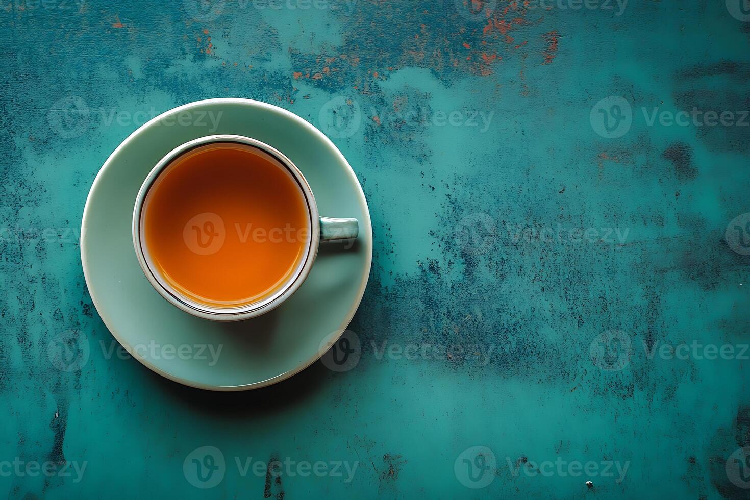 Freshly Brewed Green Tea in Cup on Wooden Table. photo