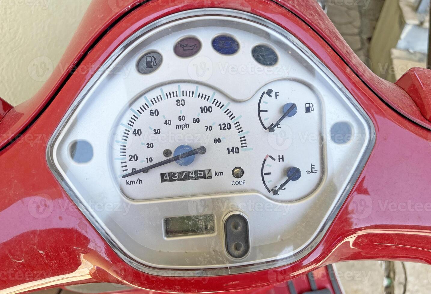 Speedometer on a red scooter close-up photo