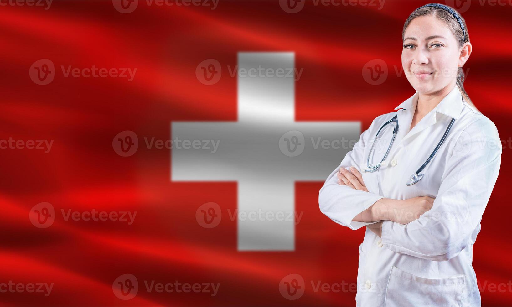 Female doctor on Switzerland flag. Doctor with crossed arms on Switzerland flag. Switzerland health and care concept photo