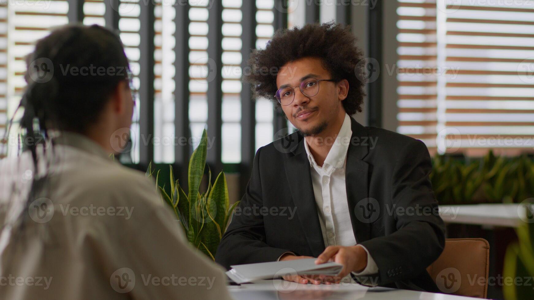 African American business leader businessman insurance agent bank reading resume intern sad client man dissatisfied refuse no failed job interview two businessmen office bad work report cooperation photo