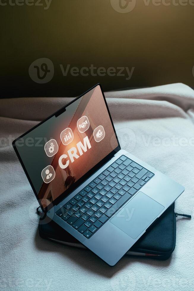 Open laptop with CRM Customer Relationship Management concept on screen. Customer management. photo