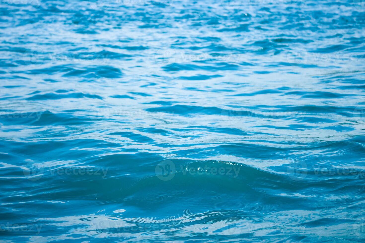 abstract background of seawater flow under light exposure photo
