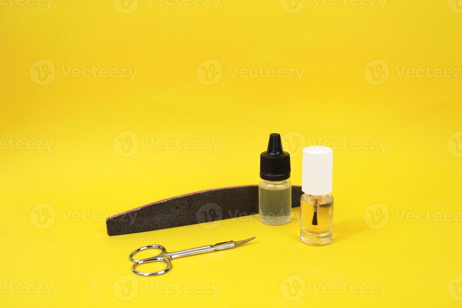 Manicure accessories on a yellow background. photo