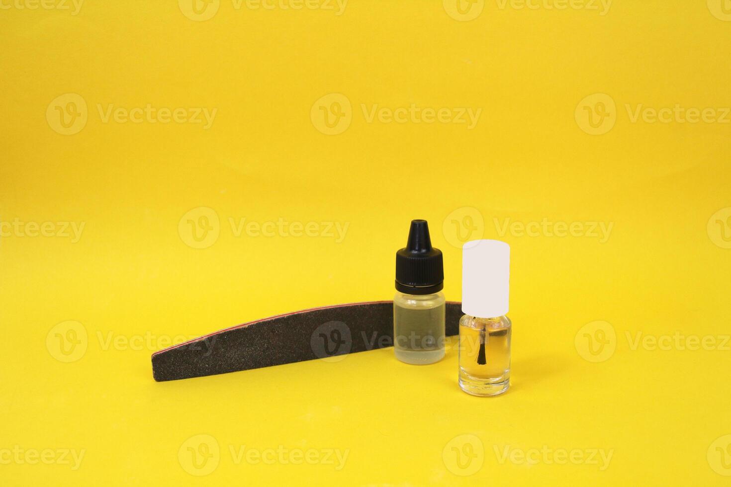 Nail file, cuticle oil and clear polish - easy manicure at home photo