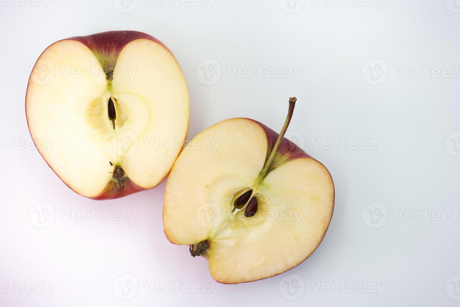 Freshly sliced apple revealing juicy interior and seeds perfect for healthy snacks and desserts photo