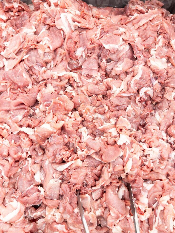 Sliced Pork Hip in Metal Tray at Market. photo