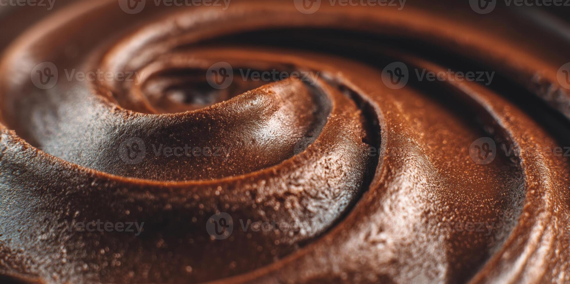 Extreme close-up of glossy chocolate mousse with glossy topping swirls, rich texture details, premium dessert macro. photo