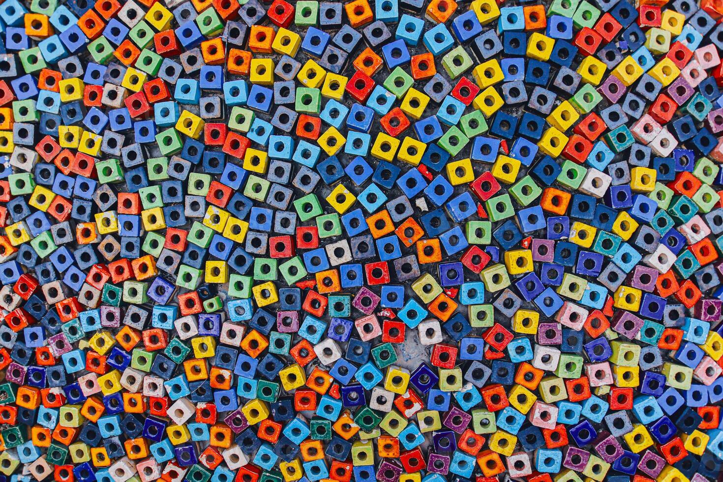 Wide Shot of colorful square bead paving on public walkway, abstract mosaic texture background representing urban diversity and creativity. photo