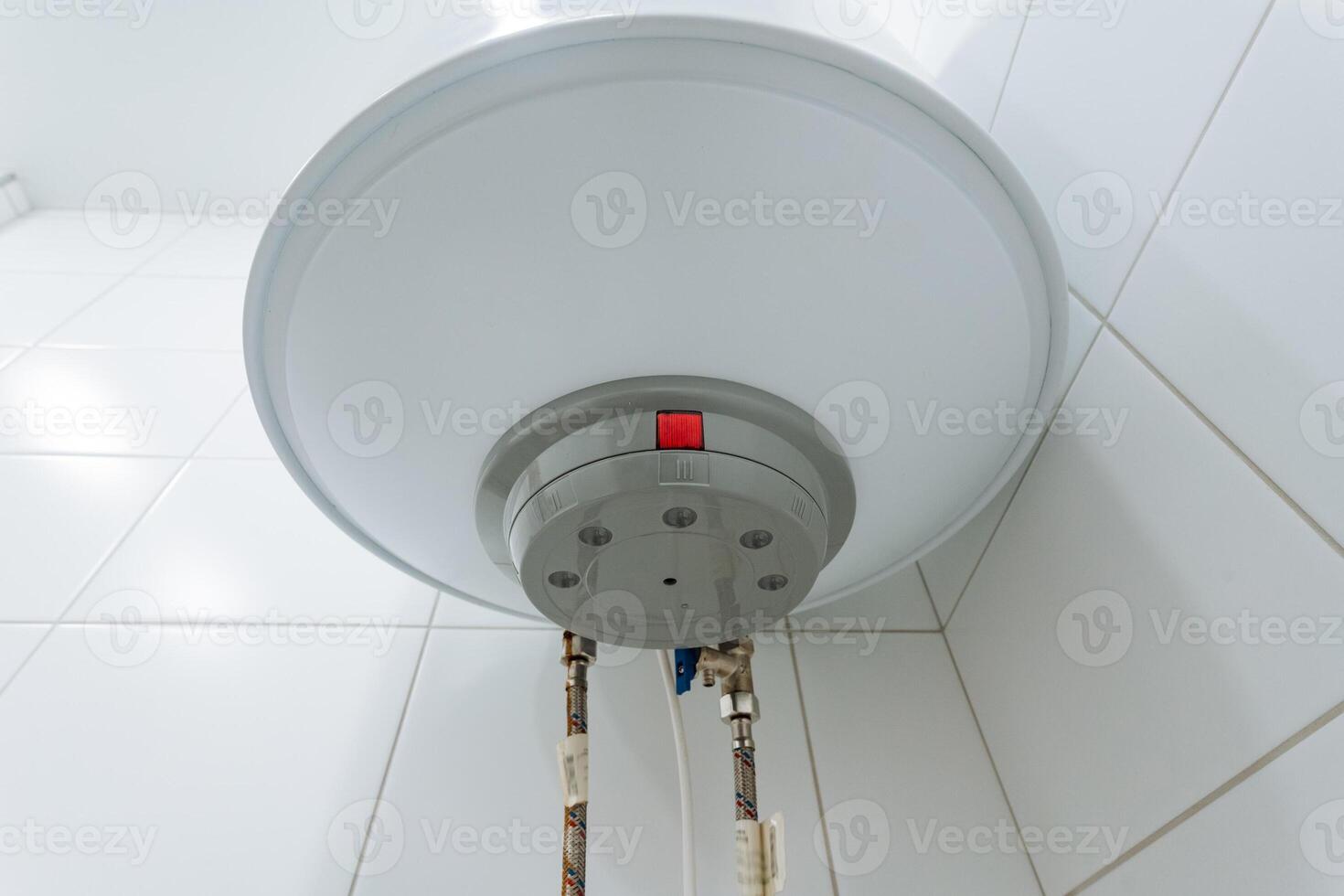 A modern bathroom design includes a sleek, energyefficient water heater on a stylish tiled wall, ensuring a reliable supply of hot water for bathing, cooking, and cleaning photo