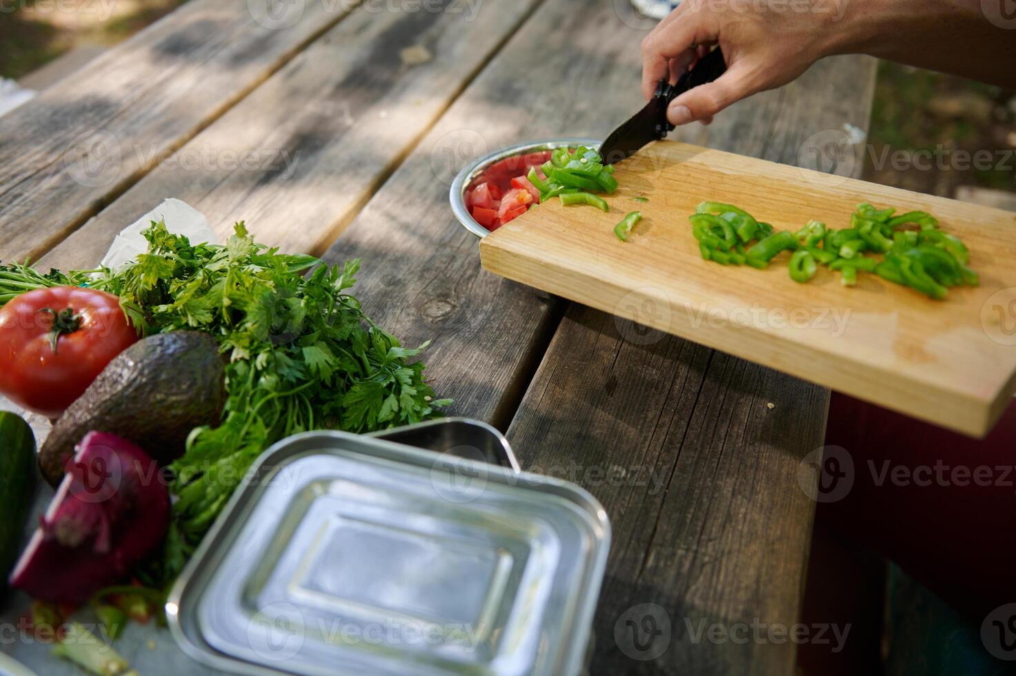 Fresh Vegetables Being Prepared Outdoors for a Delicious Meal photo