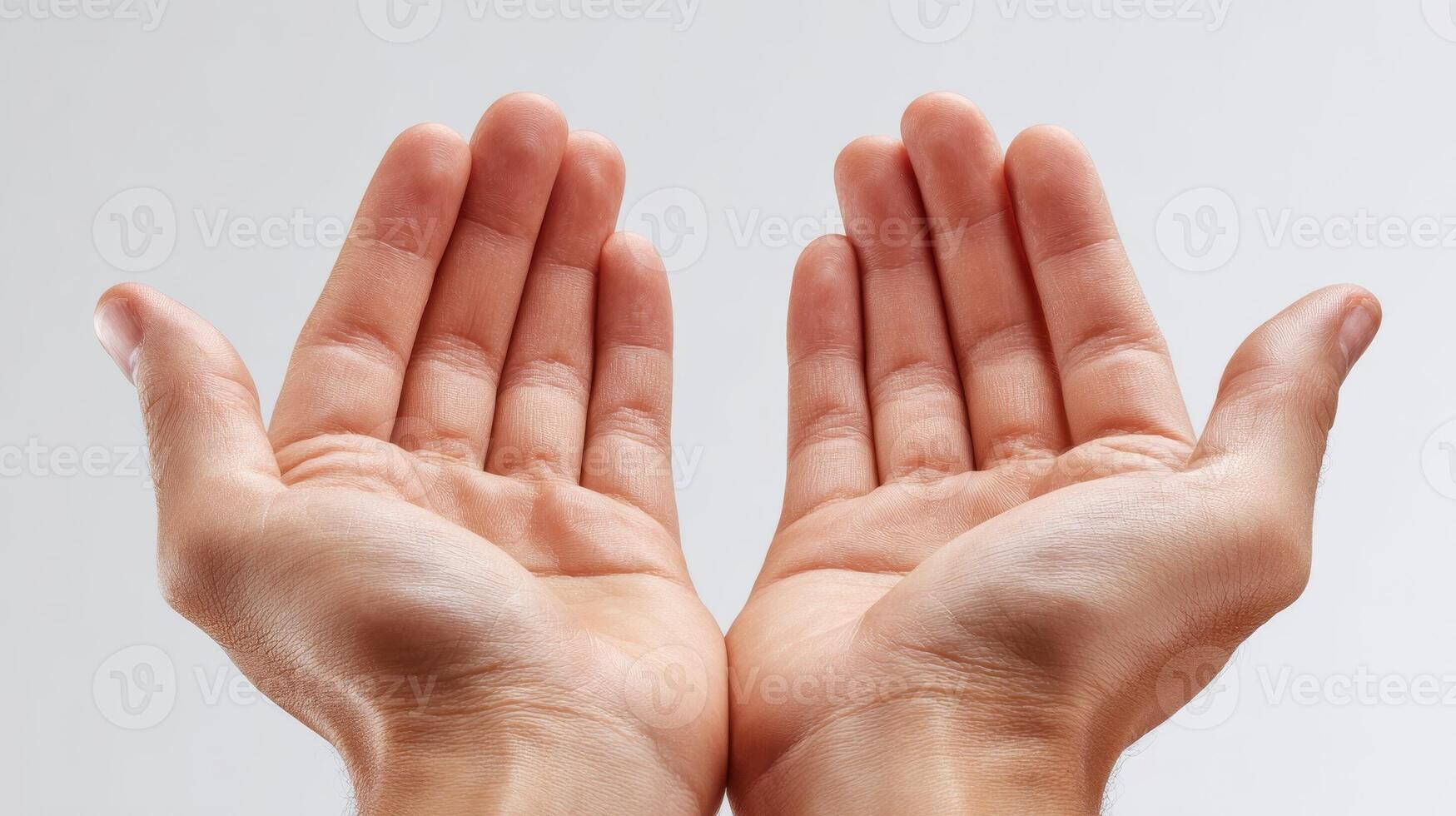 Hands open with fingers outstretched on a white background photo